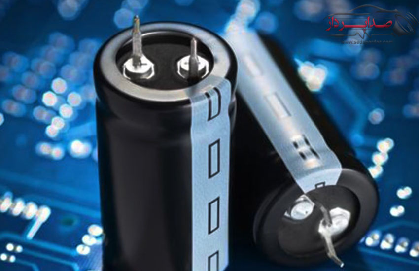 What is the role of the capacitor in the audio system